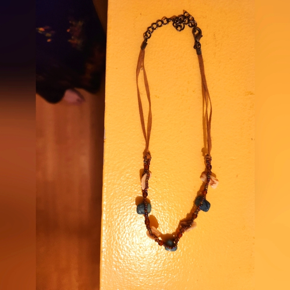 Leather necklace with shells and beads